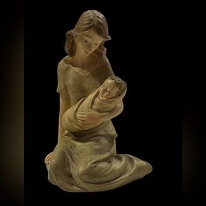 Mother Sitting holding infant figurine